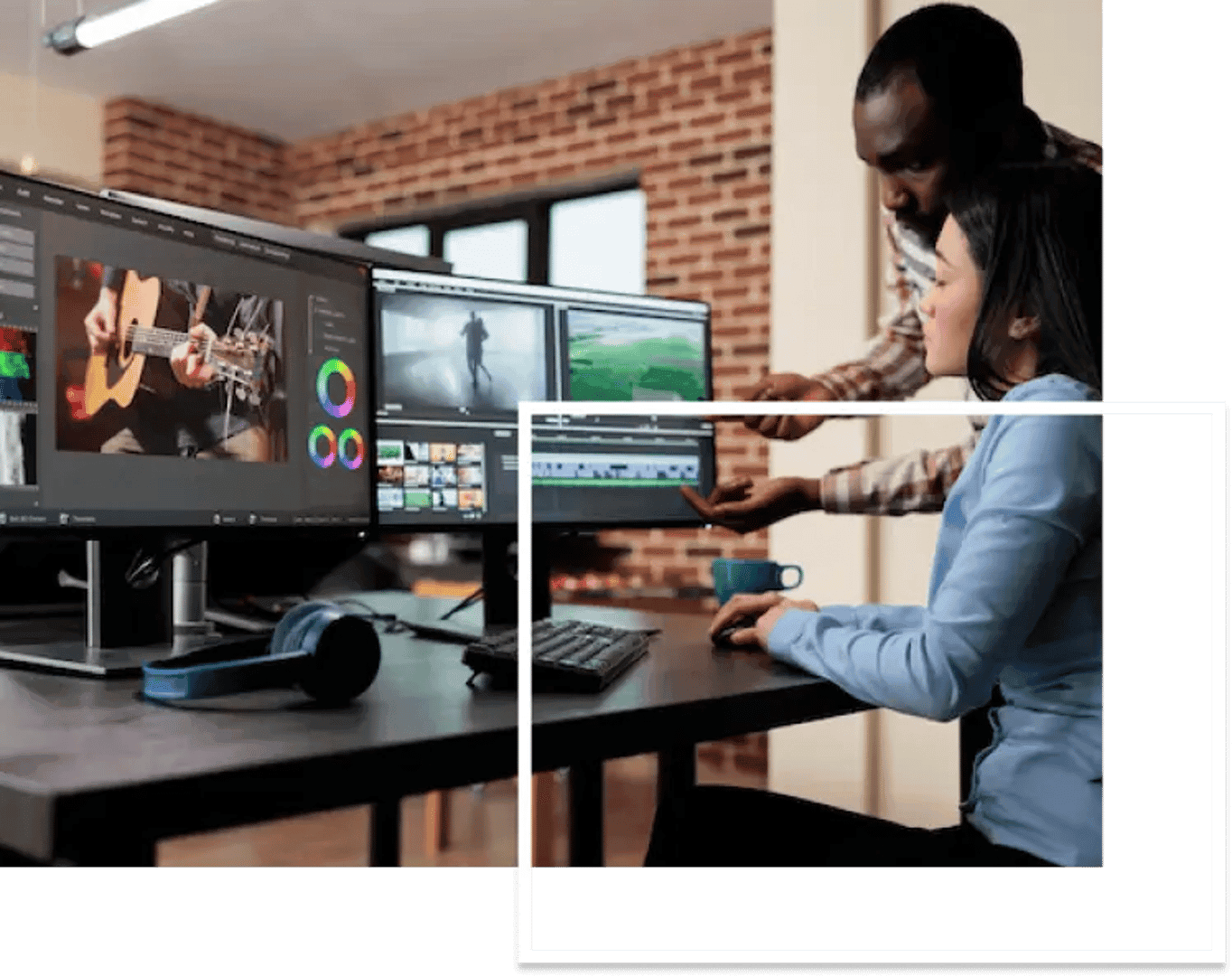 A teacher teaches video editing to his student, with two screens in front of them.