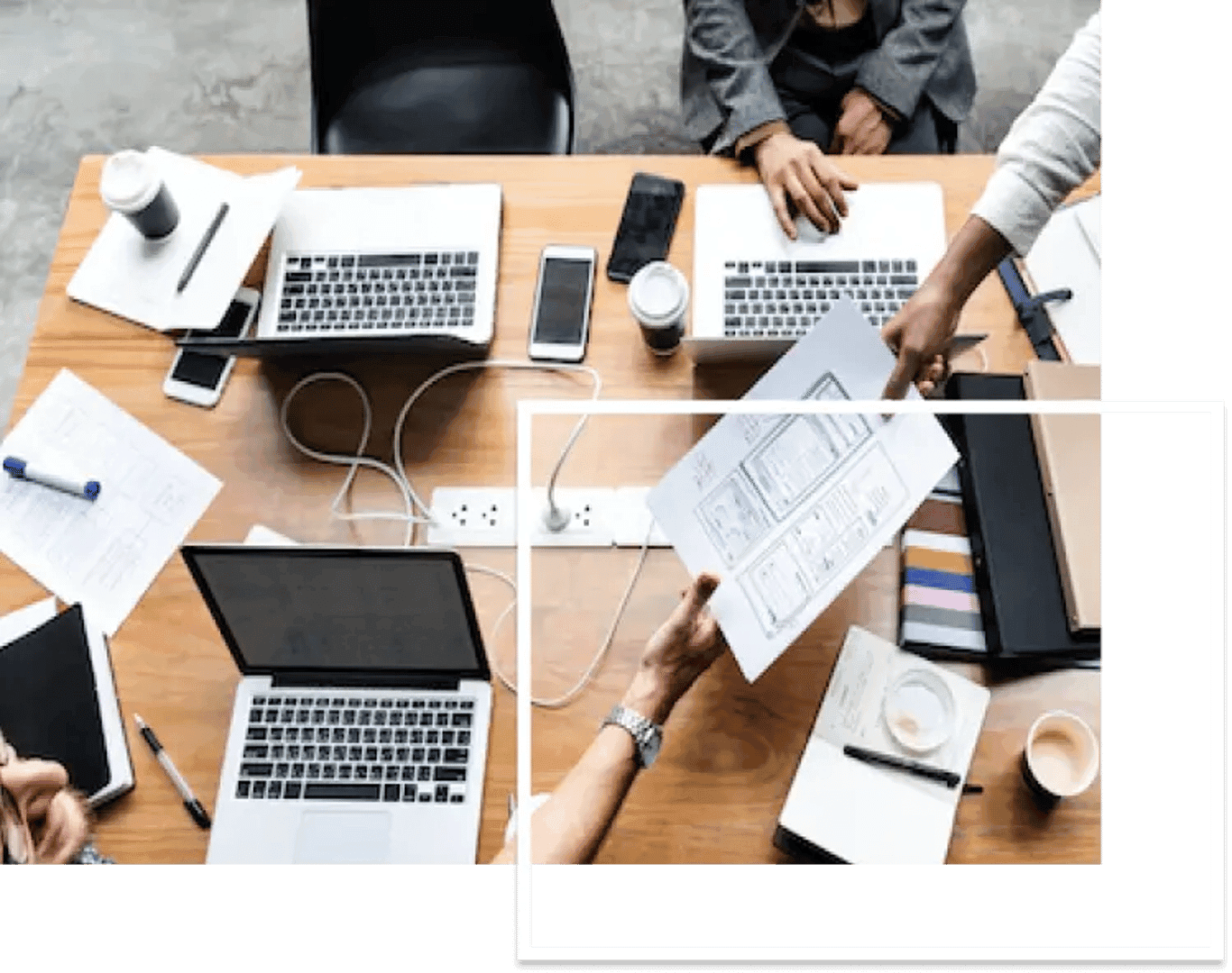 group of people sitting in a chair with laptop on a table discussing about seo strategies